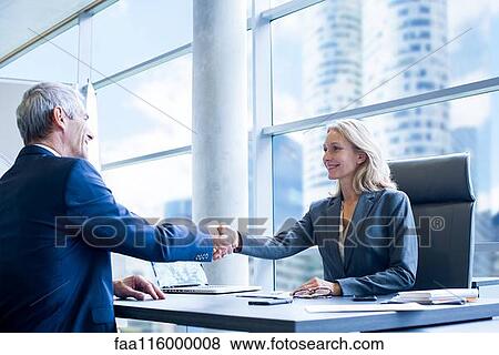 Stock Photo - Business people shaking hands. Fotosearch