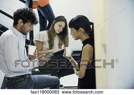 Business people using digital tablet and smartphone on steps View Large Photo Image Stock Image - Business people using digital tablet and smartphone on steps. Fotosearch