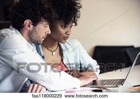 Business people working in office View Large Photo Image Stock Photo - Business people working in office. Fotosearch