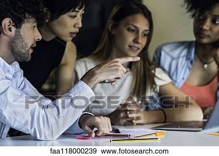 Business people working in office View Large Photo Image Stock Photo - Business people working in office. Fotosearch