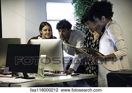 Business people working on computer in office View Large Photo Image Stock Image - Business people working on computer in office. Fotosearch