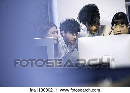 Business people working on computer in office View Large Photo Image Stock Photo - Business people working on computer in office. Fotosearch