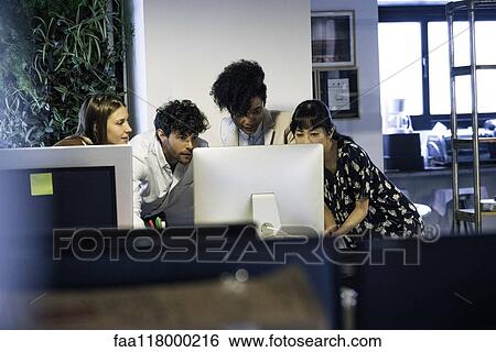 Business people working on computer in office View Large Photo Image Stock Photograph - Business people working on computer in office. Fotosearch