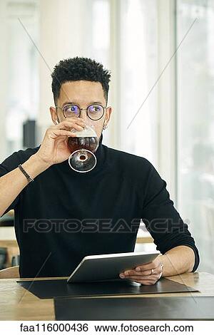 Businessman having drink View Large Photo Image Stock Photograph - Businessman having drink. Fotosearch