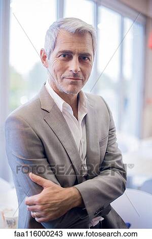 Businessman in office View Large Photo Image Stock Image - Businessman in office. Fotosearch