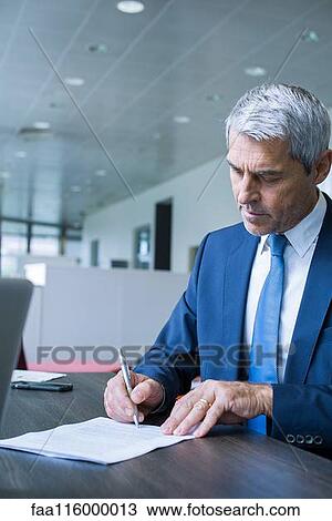 Businessman signing document View Large Photo Image Stock Image - Businessman signing document. Fotosearch