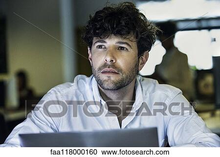 Businessman sitting in office View Large Photo Image Stock Image - Businessman sitting in office. Fotosearch