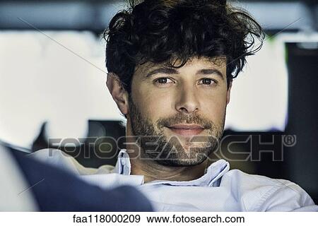 Businessman sitting in office View Large Photo Image Stock Photo - Businessman sitting in office. Fotosearch
