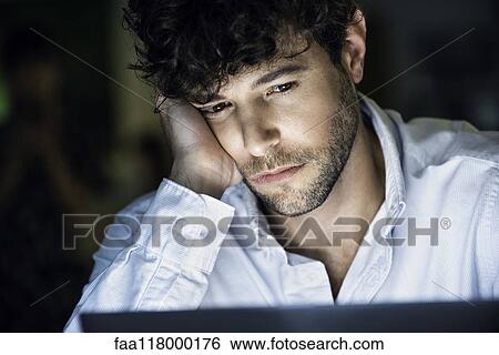 Businessman sitting in office View Large Photo Image Stock Photograph - Businessman sitting in office. Fotosearch