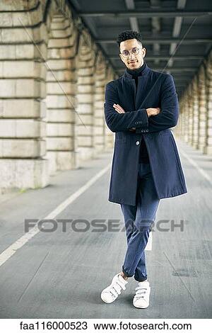 Businessman standing outdoors View Large Photo Image Stock Image - Businessman standing outdoors. Fotosearch