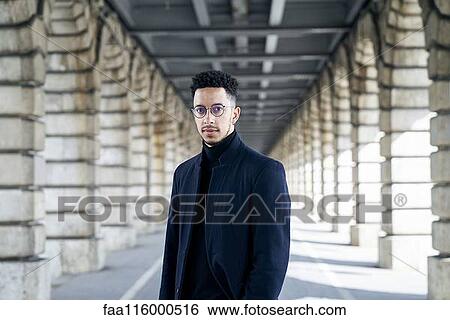 Businessman standing outdoors View Large Photo Image Stock Photograph - Businessman standing outdoors. Fotosearch