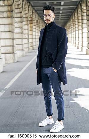 Businessman standing outdoors View Large Photo Image Stock Photography - Businessman standing outdoors. Fotosearch