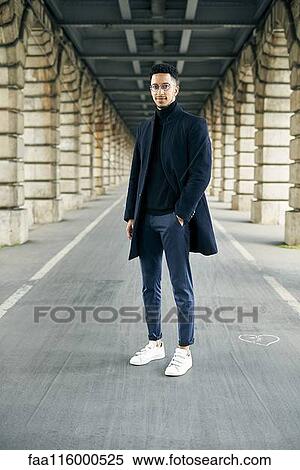 Businessman standing outdoors View Large Photo Image Stock Photography - Businessman standing outdoors. Fotosearch