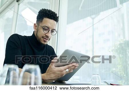 Businessman using digital tablet View Large Photo Image Stock Image - Businessman using digital tablet. Fotosearch