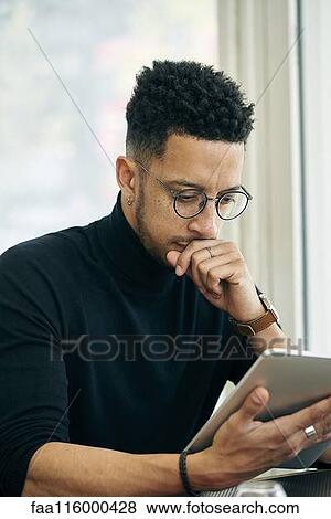 Businessman using digital tablet View Large Photo Image Stock Photo - Businessman using digital tablet. Fotosearch