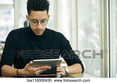 Businessman using digital tablet View Large Photo Image Stock Photography - Businessman using digital tablet. Fotosearch