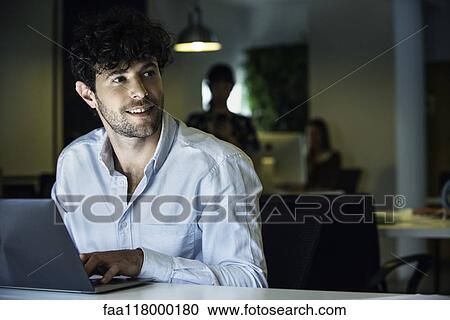 Businessman using laptop View Large Photo Image Stock Image - Businessman using laptop. Fotosearch