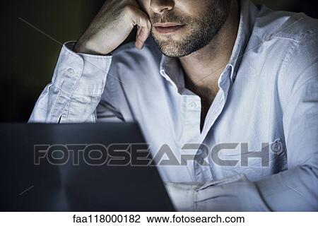 Businessman using laptop View Large Photo Image Stock Image - Businessman using laptop. Fotosearch