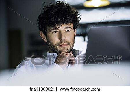 Stock Image - Businessman using laptop. Fotosearch
