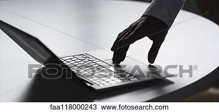Stock Image - Businessman using laptop. Fotosearch