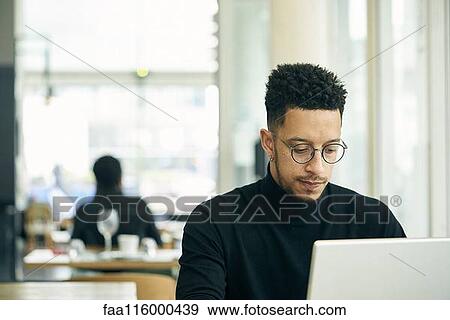 Stock Photo - Businessman using laptop. Fotosearch
