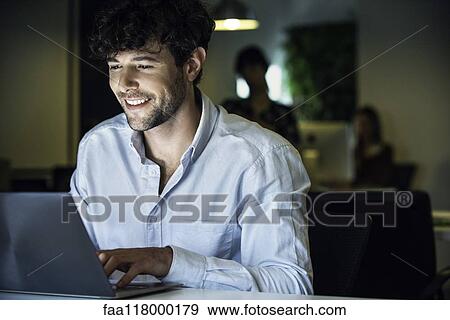 Stock Photo - Businessman using laptop. Fotosearch