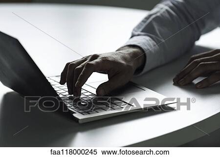 Businessman using laptop View Large Photo Image Stock Photography - Businessman using laptop. Fotosearch