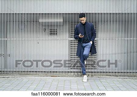Businessman using smartphone View Large Photo Image Stock Image - Businessman using smartphone. Fotosearch