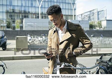 Businessman using smartphone View Large Photo Image Stock Image - Businessman using smartphone. Fotosearch