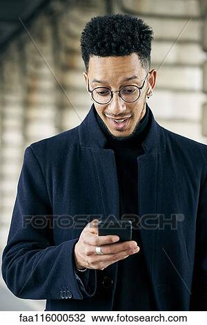 Businessman using smartphone View Large Photo Image Stock Image - Businessman using smartphone. Fotosearch