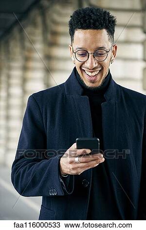 Businessman using smartphone View Large Photo Image Stock Image - Businessman using smartphone. Fotosearch