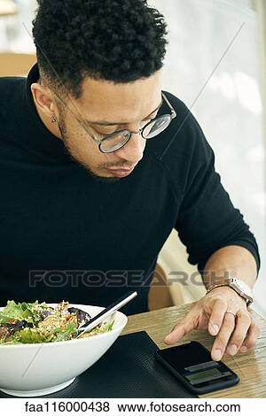 Stock Photo - Businessman using smartphone. Fotosearch