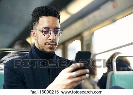Stock Photography - Businessman using smartphone. Fotosearch