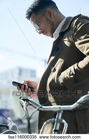 Businessman using smartphone View Large Photo Image Stock Photography - Businessman using smartphone. Fotosearch