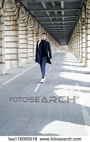 Businessman walking outdoors View Large Photo Image Stock Photo - Businessman walking outdoors. Fotosearch