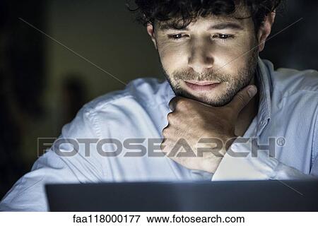Stock Photo - Businessman working in office. Fotosearch