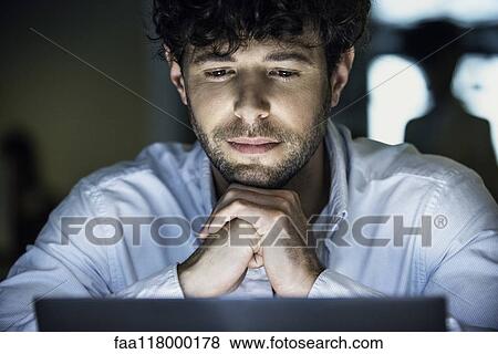 Stock Photo - Businessman working in office. Fotosearch