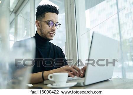 Businessman working on laptop View Large Photo Image Stock Image - Businessman working on laptop. Fotosearch