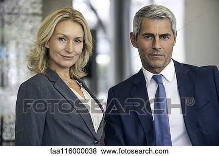 Businesspeople in office View Large Photo Image Stock Photo - Businesspeople in office. Fotosearch