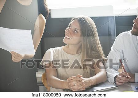 Businesswoman giving presentation in office View Large Photo Image Stock Image - Businesswoman giving presentation in office. Fotosearch