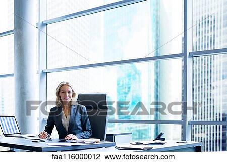 Businesswoman in office View Large Photo Image Stock Image - Businesswoman in office. Fotosearch