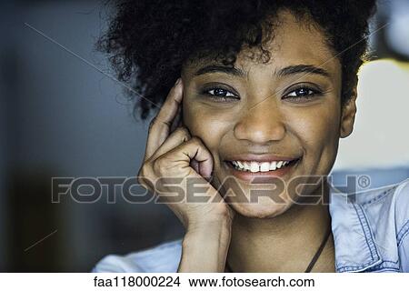 Businesswoman sitting in office View Large Photo Image Picture - Businesswoman sitting in office. Fotosearch