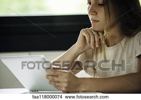 Businesswoman using digital tablet View Large Photo Image Picture - Businesswoman using digital tablet. Fotosearch