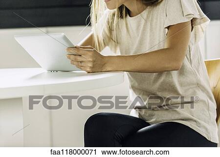 Businesswoman using digital tablet View Large Photo Image Stock Image - Businesswoman using digital tablet. Fotosearch