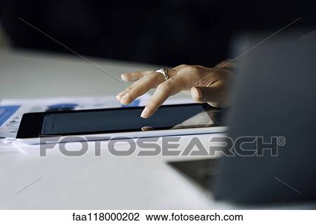 Businesswoman using digital tablet View Large Photo Image Stock Image - Businesswoman using digital tablet. Fotosearch
