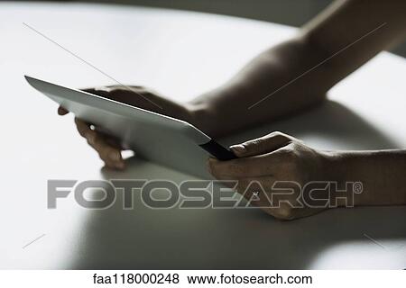 Businesswoman using digital tablet View Large Photo Image Stock Photo - Businesswoman using digital tablet. Fotosearch