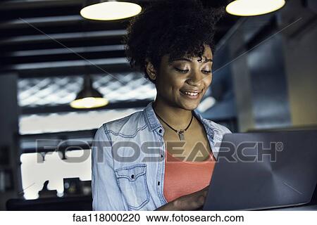 Businesswoman using laptop View Large Photo Image Stock Image - Businesswoman using laptop. Fotosearch