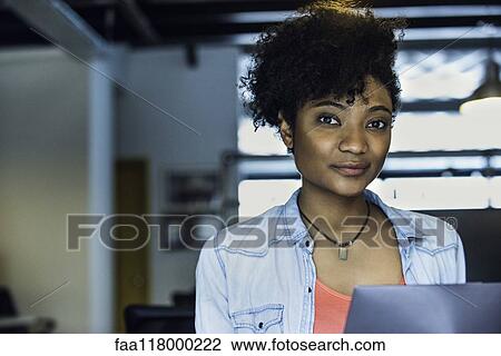 Businesswoman using laptop View Large Photo Image Stock Image - Businesswoman using laptop. Fotosearch