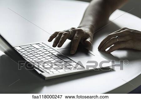 Stock Photo - Businesswoman using laptop. Fotosearch