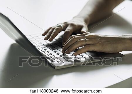 Businesswoman using laptop View Large Photo Image Stock Photograph - Businesswoman using laptop. Fotosearch